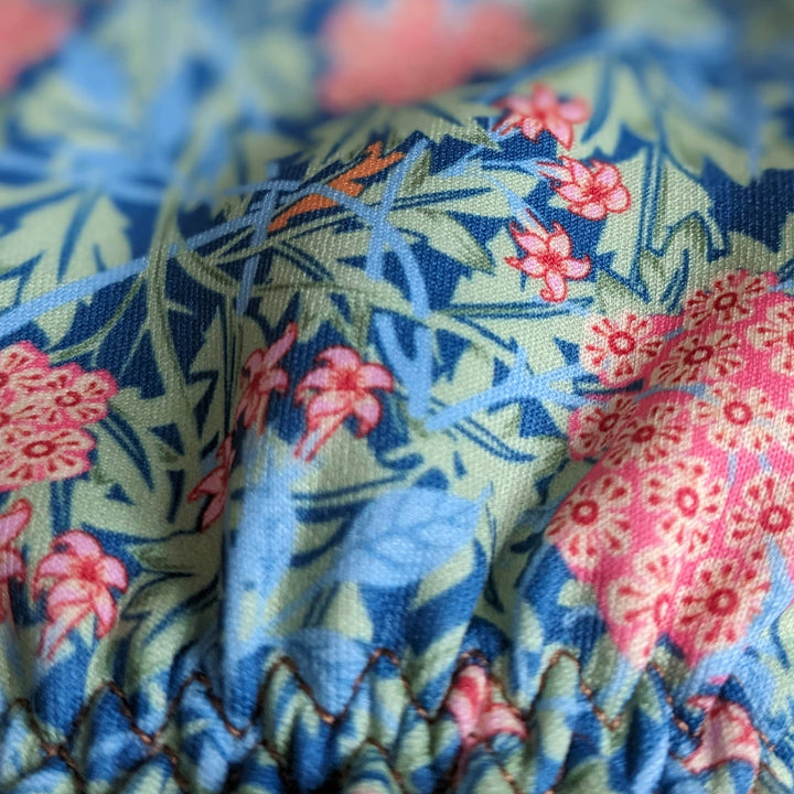 Close-up of fabric with floral and animal pattern