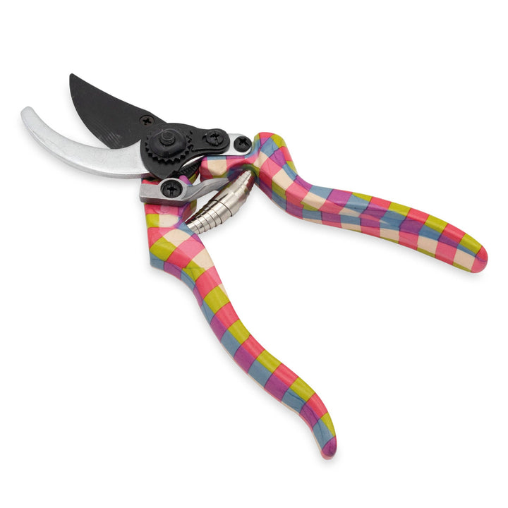 Gardening shears with colorful plaid handles on a white background
