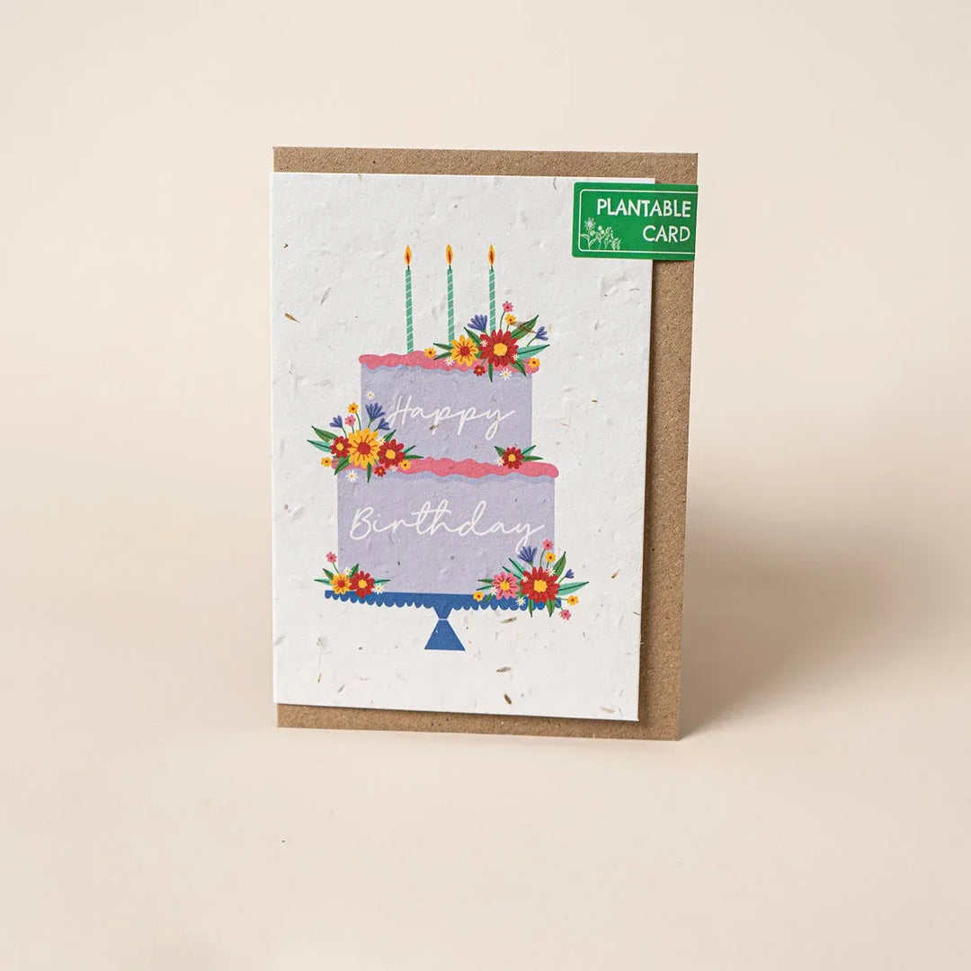 Plantable birthday card with a cake illustration on a beige background