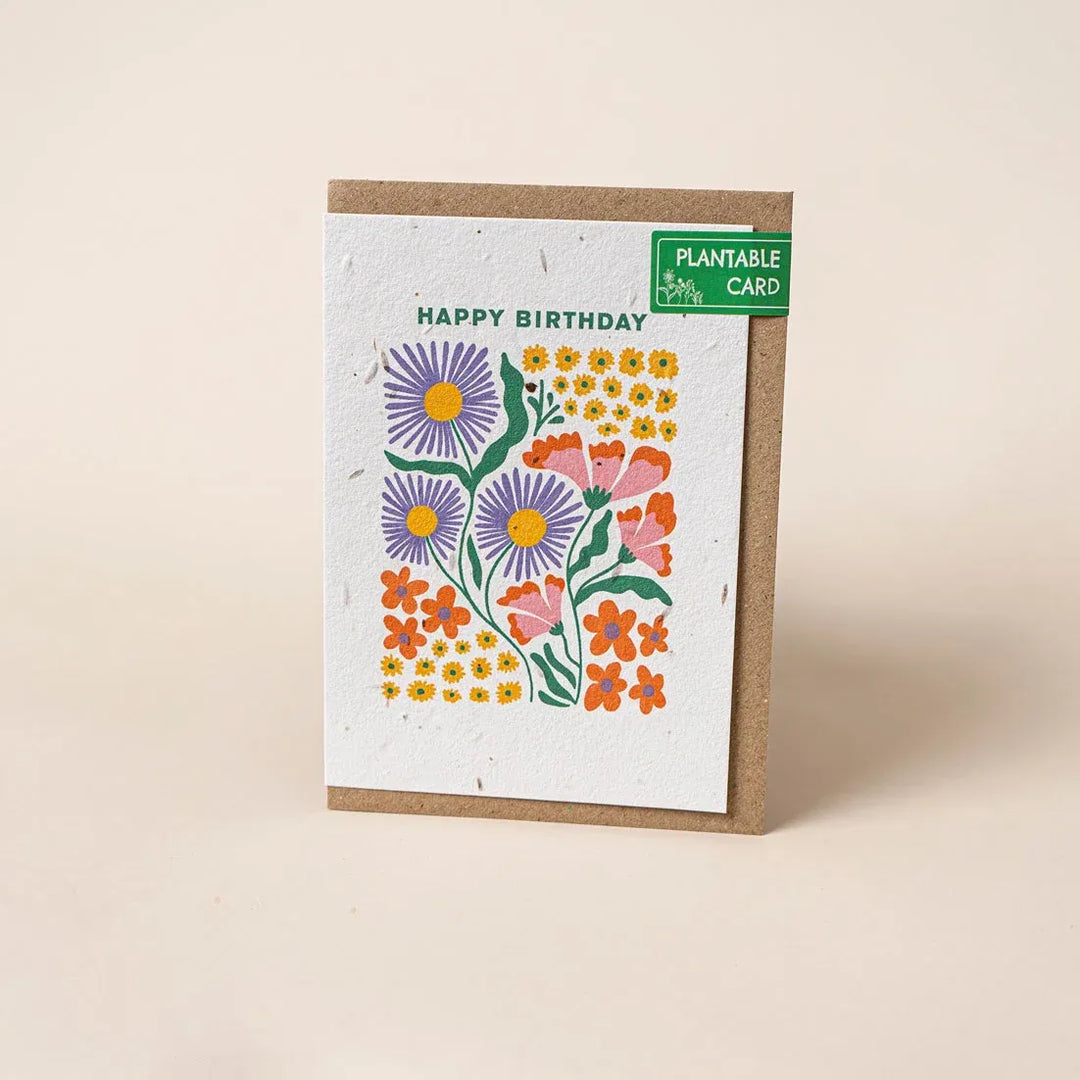 Plantable birthday card with floral design on a beige background