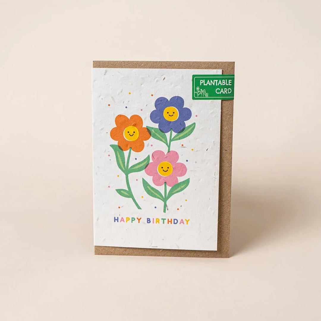 Plantable birthday card with colorful flowers on a beige background