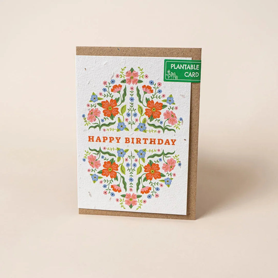 Plantable birthday card with floral design on a beige background