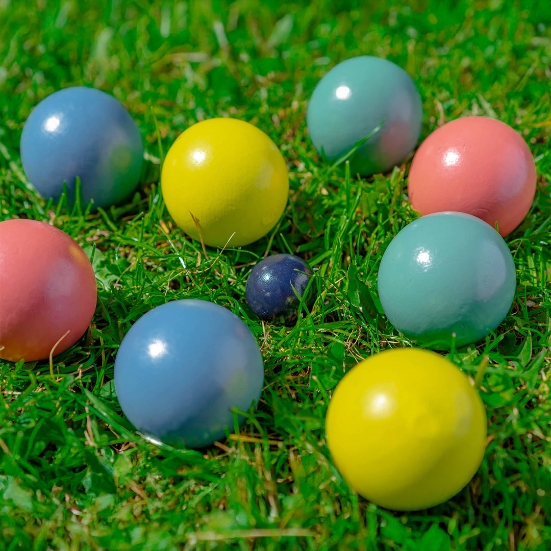Colorful balls on a grassy surface