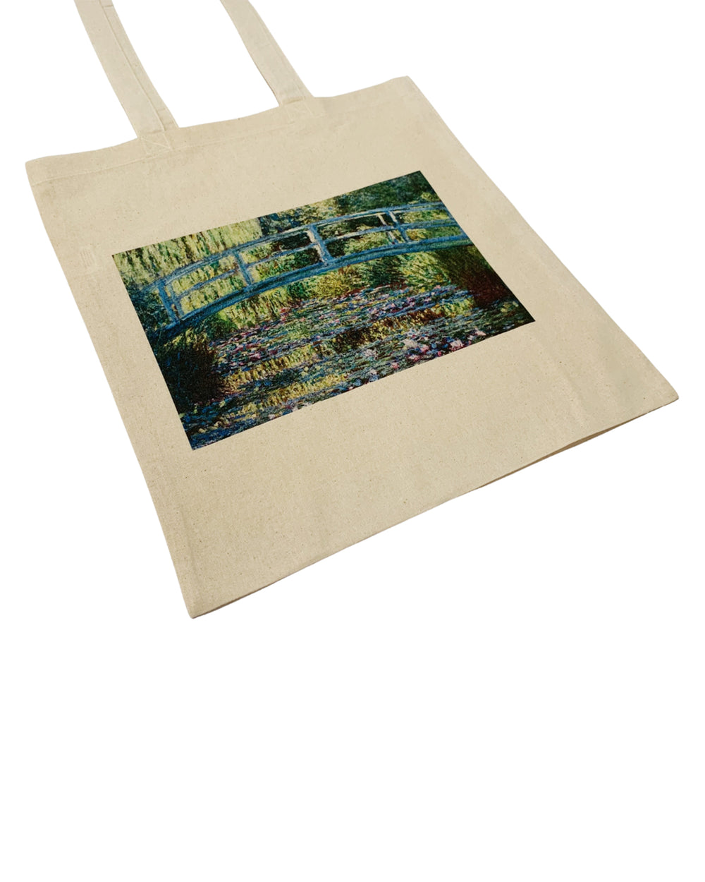 Beige tote bag with a printed design of a garden scene on a white background