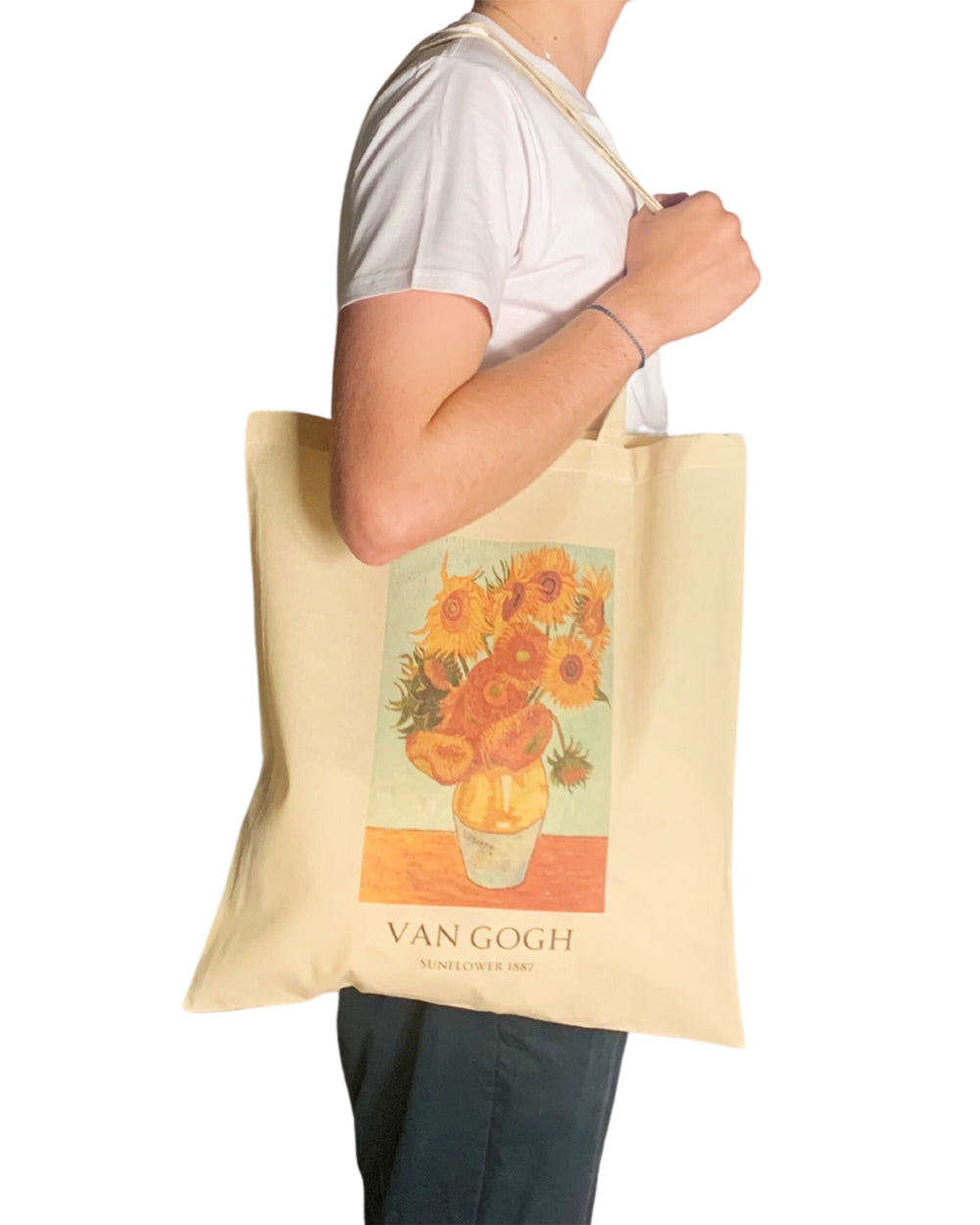 Tote bag with Van Gogh sunflower design held by a person