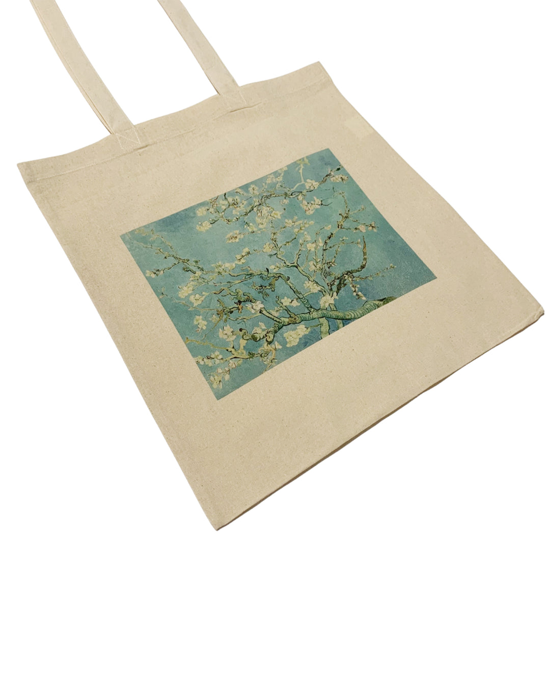Beige tote bag with a square design of almond branches on a white background